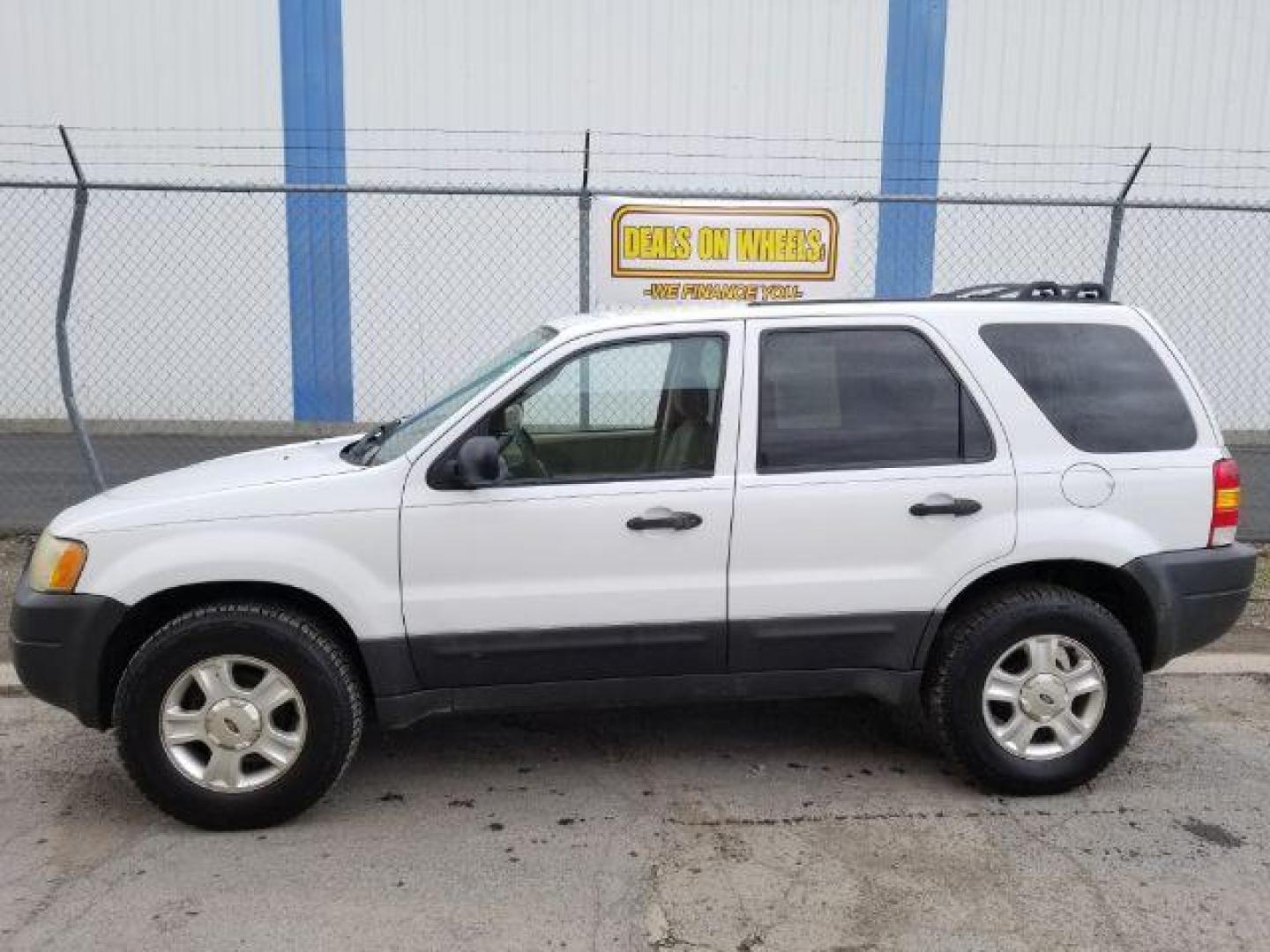 2004 Oxford White Ford Escape XLT 4WD (1FMYU93114D) with an 3.0L V6 DOHC 24V engine, 4-Speed Automatic transmission, located at 1821 N Montana Ave., Helena, MT, 59601, 0.000000, 0.000000 - Photo#2