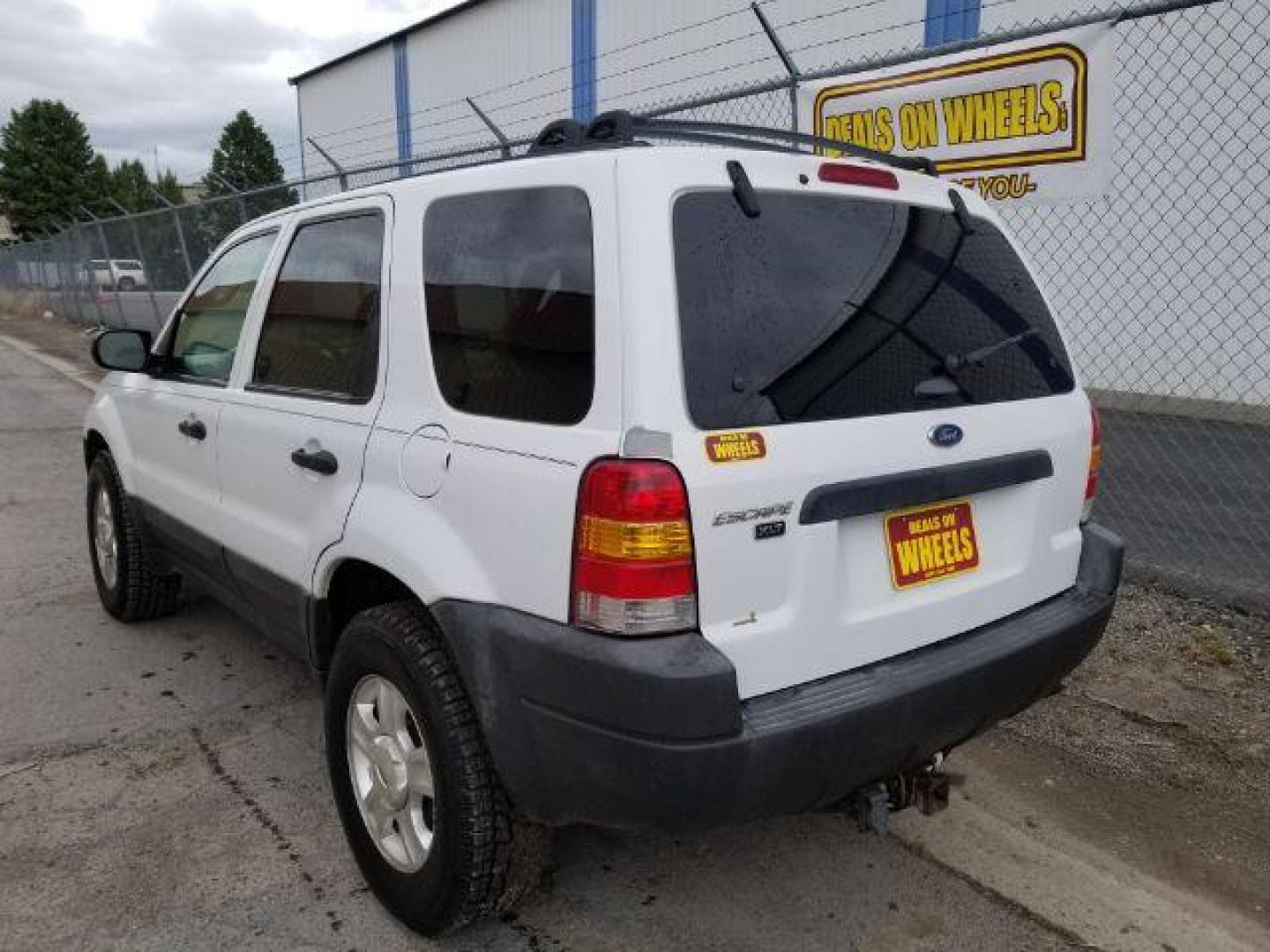 2004 Oxford White Ford Escape XLT 4WD (1FMYU93114D) with an 3.0L V6 DOHC 24V engine, 4-Speed Automatic transmission, located at 1821 N Montana Ave., Helena, MT, 59601, 0.000000, 0.000000 - Photo#3