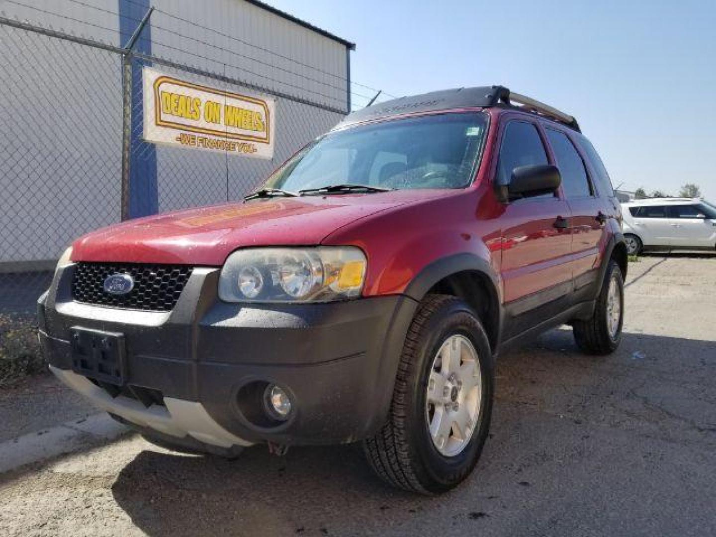 2005 Red Fire Metallic Ford Escape XLT 4WD (1FMYU93125K) with an 3.0L V6 DOHC 24V engine, 4-Speed Automatic transmission, located at 4801 10th Ave S,, Great Falls, MT, 59405, (406) 564-1505, 0.000000, 0.000000 - Photo#0