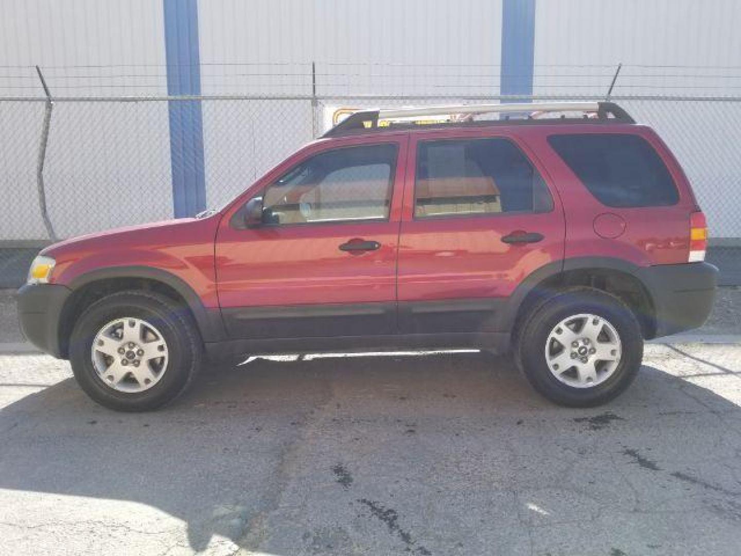 2005 Red Fire Metallic Ford Escape XLT 4WD (1FMYU93125K) with an 3.0L V6 DOHC 24V engine, 4-Speed Automatic transmission, located at 4801 10th Ave S,, Great Falls, MT, 59405, (406) 564-1505, 0.000000, 0.000000 - Photo#2