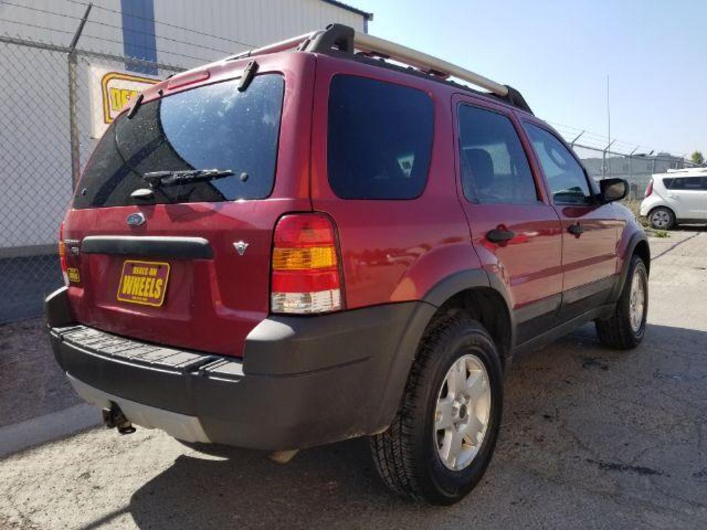 2005 Red Fire Metallic Ford Escape XLT 4WD (1FMYU93125K) with an 3.0L V6 DOHC 24V engine, 4-Speed Automatic transmission, located at 4801 10th Ave S,, Great Falls, MT, 59405, (406) 564-1505, 0.000000, 0.000000 - Photo#4