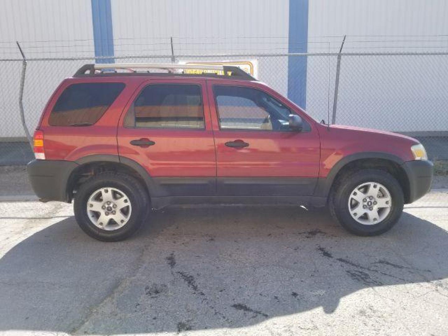 2005 Red Fire Metallic Ford Escape XLT 4WD (1FMYU93125K) with an 3.0L V6 DOHC 24V engine, 4-Speed Automatic transmission, located at 4801 10th Ave S,, Great Falls, MT, 59405, (406) 564-1505, 0.000000, 0.000000 - Photo#5