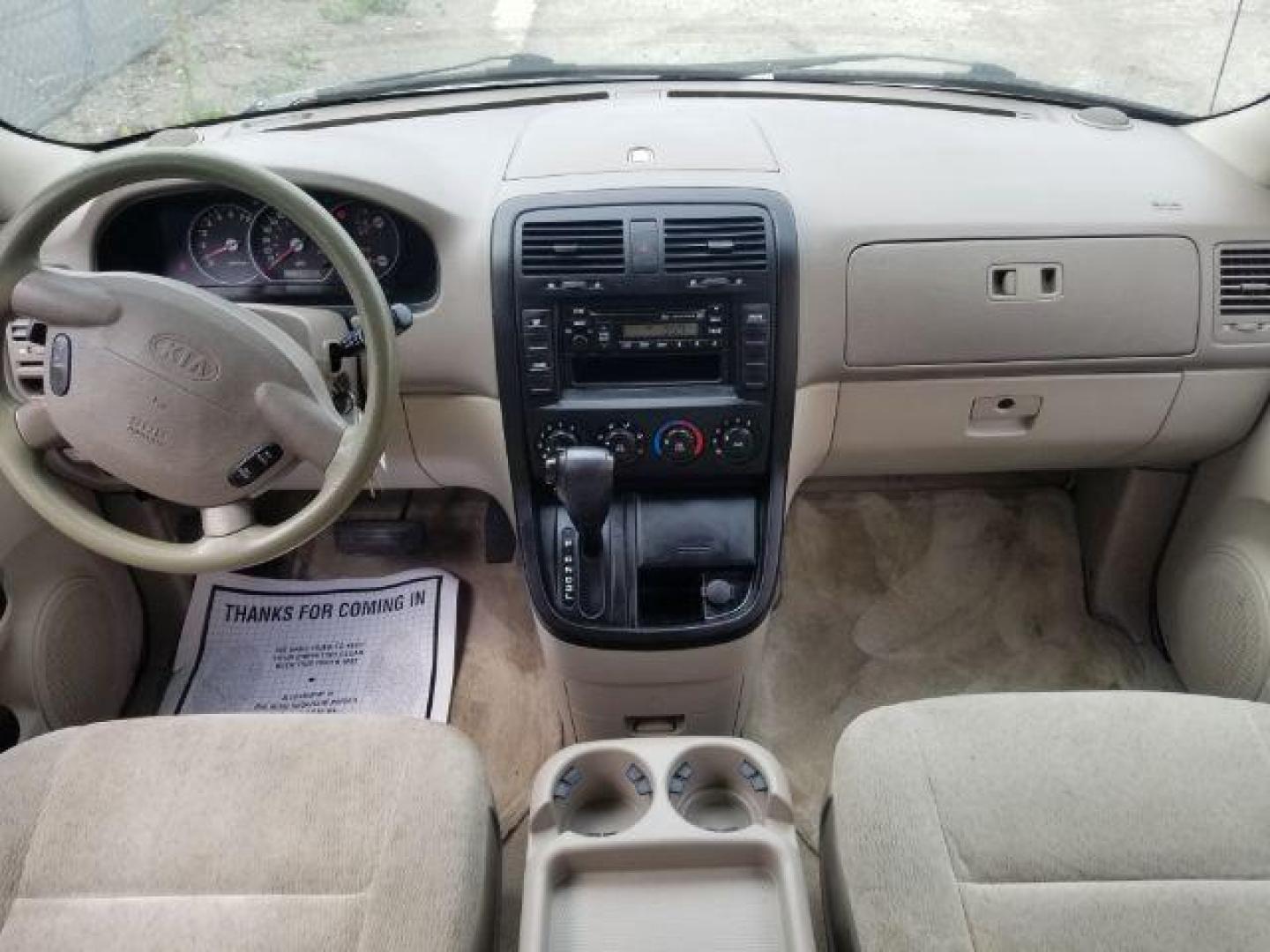 2005 Clear White /Beige Cloth Interior Kia Sedona LX (KNDUP132856) with an 3.5L V6 DOHC 16V engine, 5-Speed Automatic transmission, located at 4801 10th Ave S,, Great Falls, MT, 59405, (406) 564-1505, 0.000000, 0.000000 - Photo#11