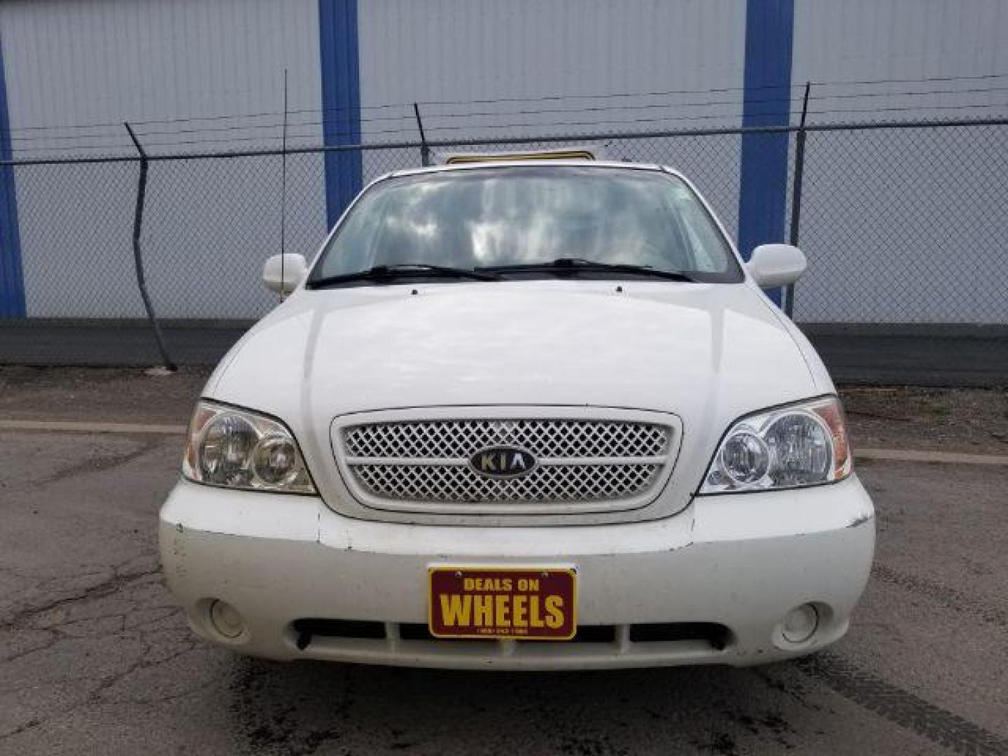 2005 Clear White /Beige Cloth Interior Kia Sedona LX (KNDUP132856) with an 3.5L V6 DOHC 16V engine, 5-Speed Automatic transmission, located at 4801 10th Ave S,, Great Falls, MT, 59405, (406) 564-1505, 0.000000, 0.000000 - Photo#1