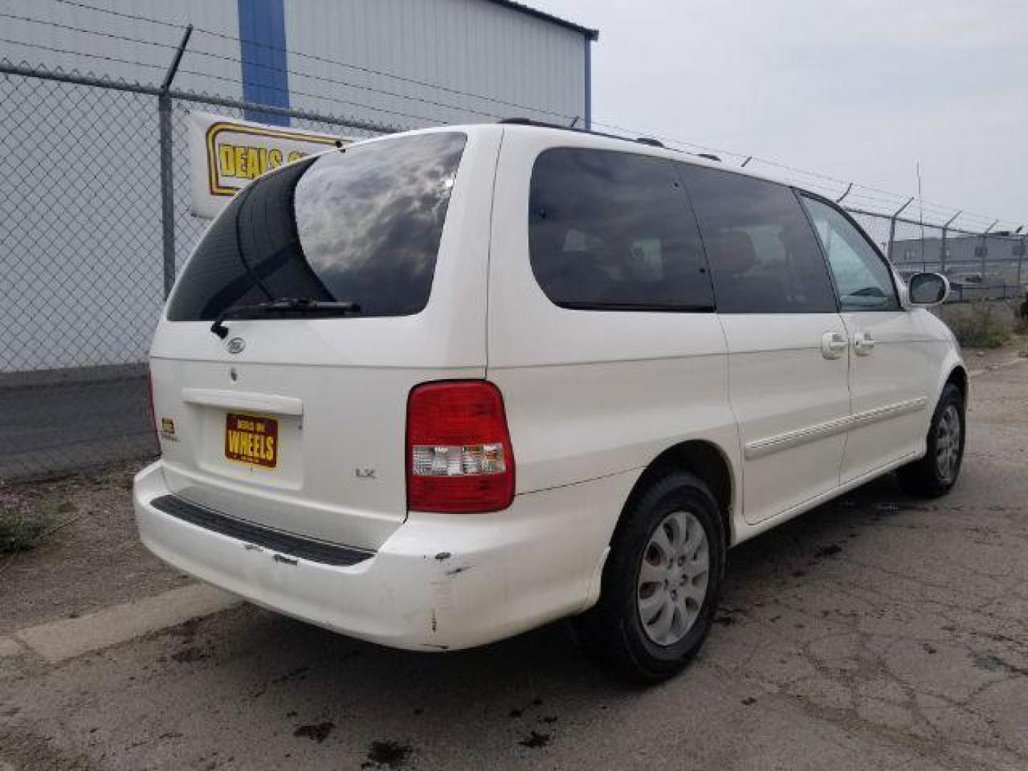 2005 Clear White /Beige Cloth Interior Kia Sedona LX (KNDUP132856) with an 3.5L V6 DOHC 16V engine, 5-Speed Automatic transmission, located at 4801 10th Ave S,, Great Falls, MT, 59405, (406) 564-1505, 0.000000, 0.000000 - Photo#4