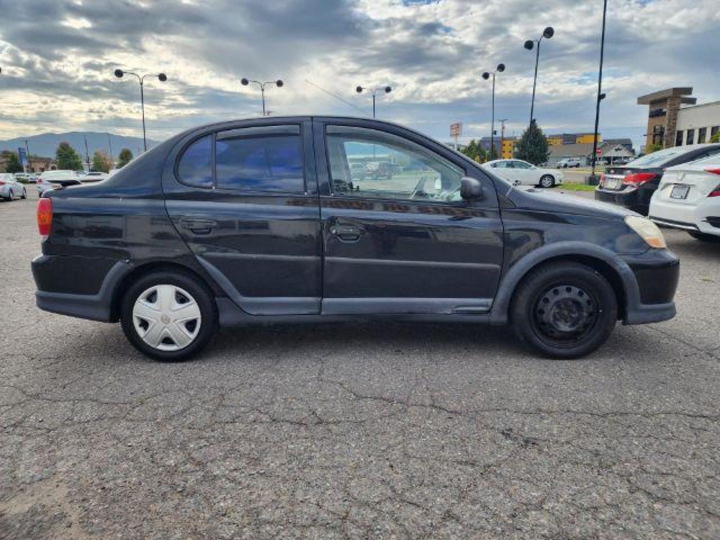 2005 Black Sand Pearl Toyota Echo 4-Door Sedan (JTDBT123050) with an 1.5L L4 DOHC 16V engine, located at 1800 West Broadway, Missoula, 59808, (406) 543-1986, 46.881348, -114.023628 - Photo#2