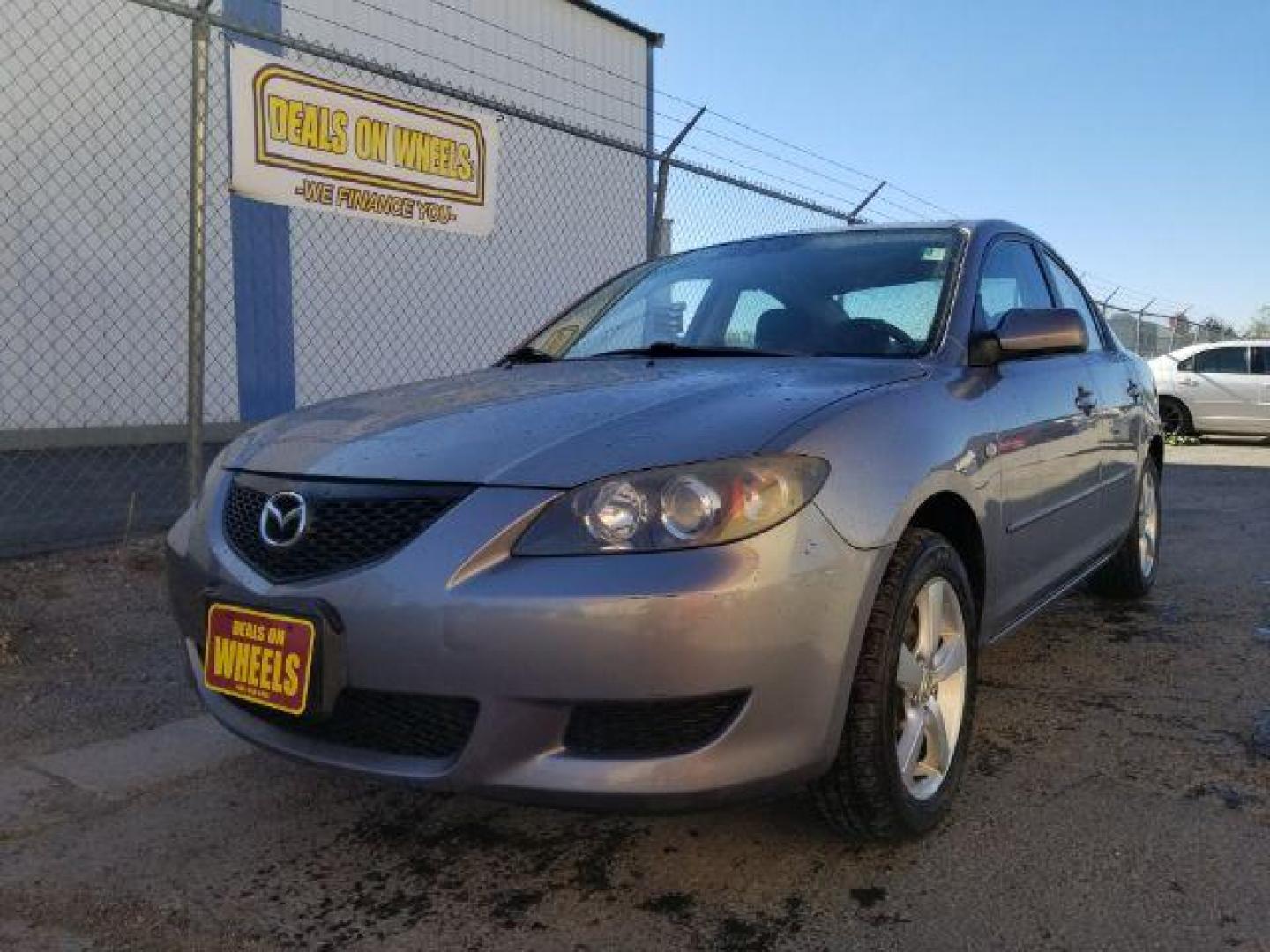 2006 Mazda MAZDA3 i 4-door (JM1BK12FX61) with an 2.0L L4 DOHC 16V engine, located at 601 E. Idaho St., Kalispell, MT, 59901, 0.000000, 0.000000 - Photo#0