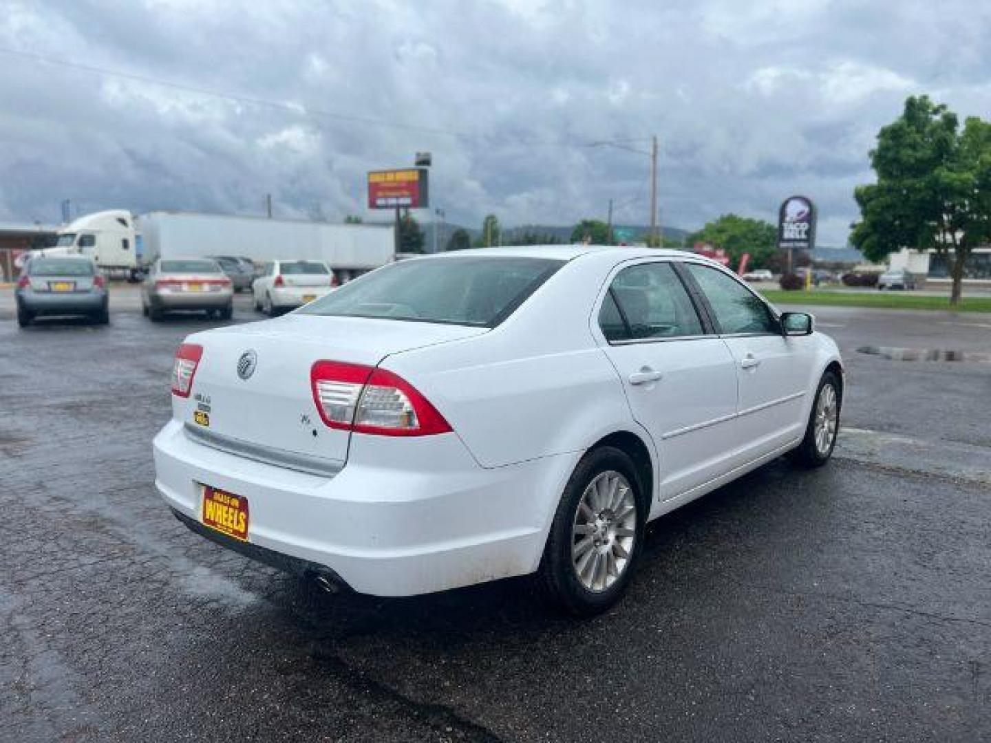 2006 Mercury Milan V6 Premier (3MEFM08106R) with an 3.0L V6 DOHC 24V engine, 6-Speed Automatic transmission, located at 4047 Montana Ave., Billings, MT, 59101, 45.770847, -108.529800 - Photo#4