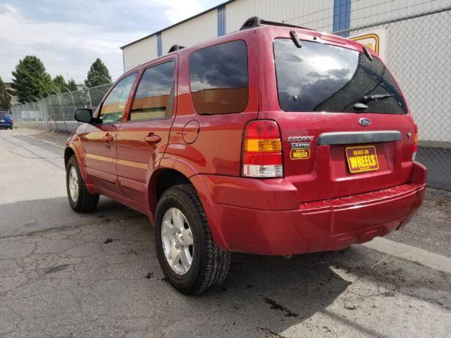 2007 Red Fire Metallic Ford Escape Limited 4WD (1FMYU94127K) with an 3.0L V6 DOHC 24V engine, 4-Speed Automatic transmission, located at 4801 10th Ave S,, Great Falls, MT, 59405, (406) 564-1505, 0.000000, 0.000000 - Photo#2