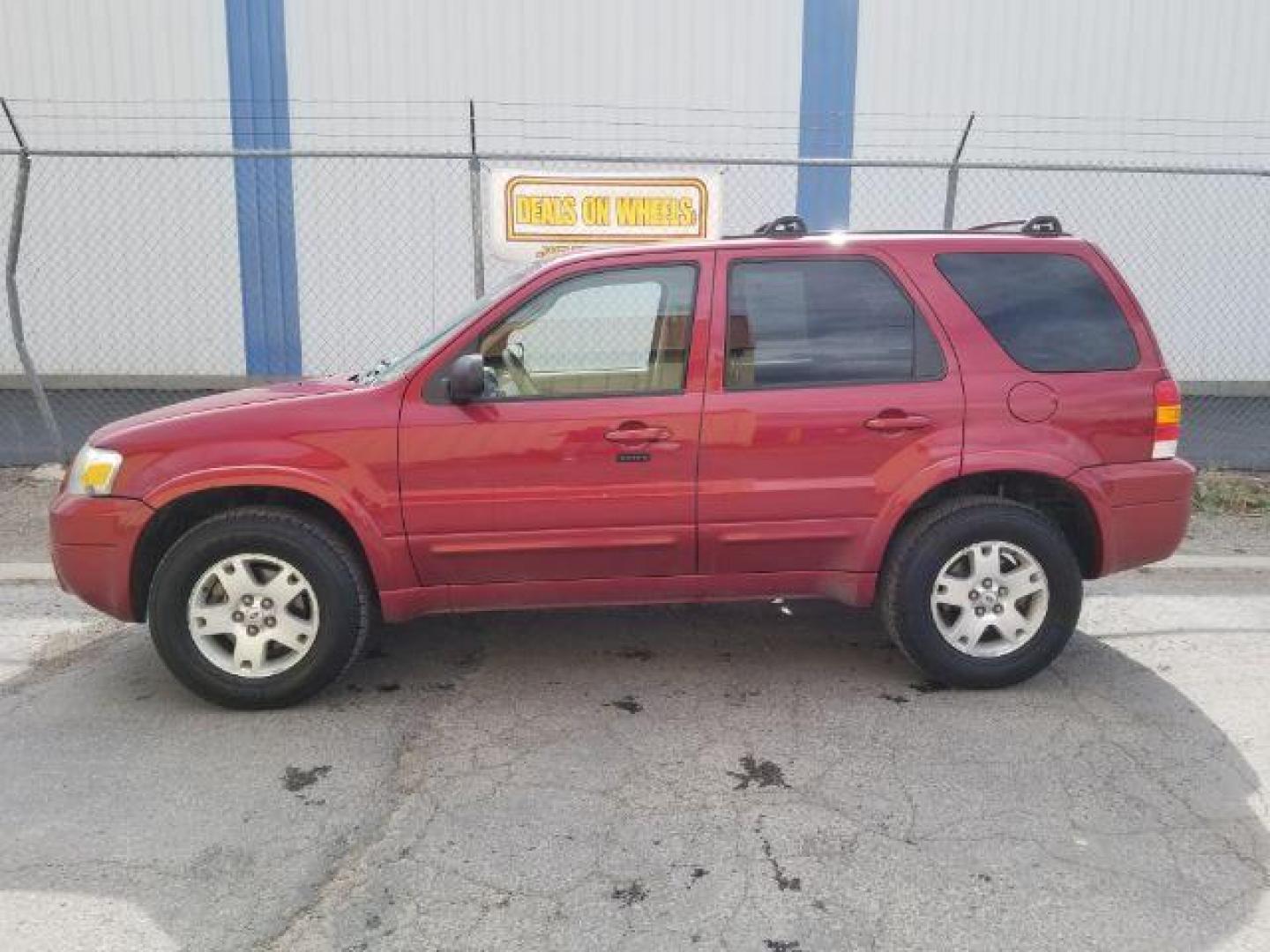 2007 Red Fire Metallic Ford Escape Limited 4WD (1FMYU94127K) with an 3.0L V6 DOHC 24V engine, 4-Speed Automatic transmission, located at 4801 10th Ave S,, Great Falls, MT, 59405, (406) 564-1505, 0.000000, 0.000000 - Photo#3