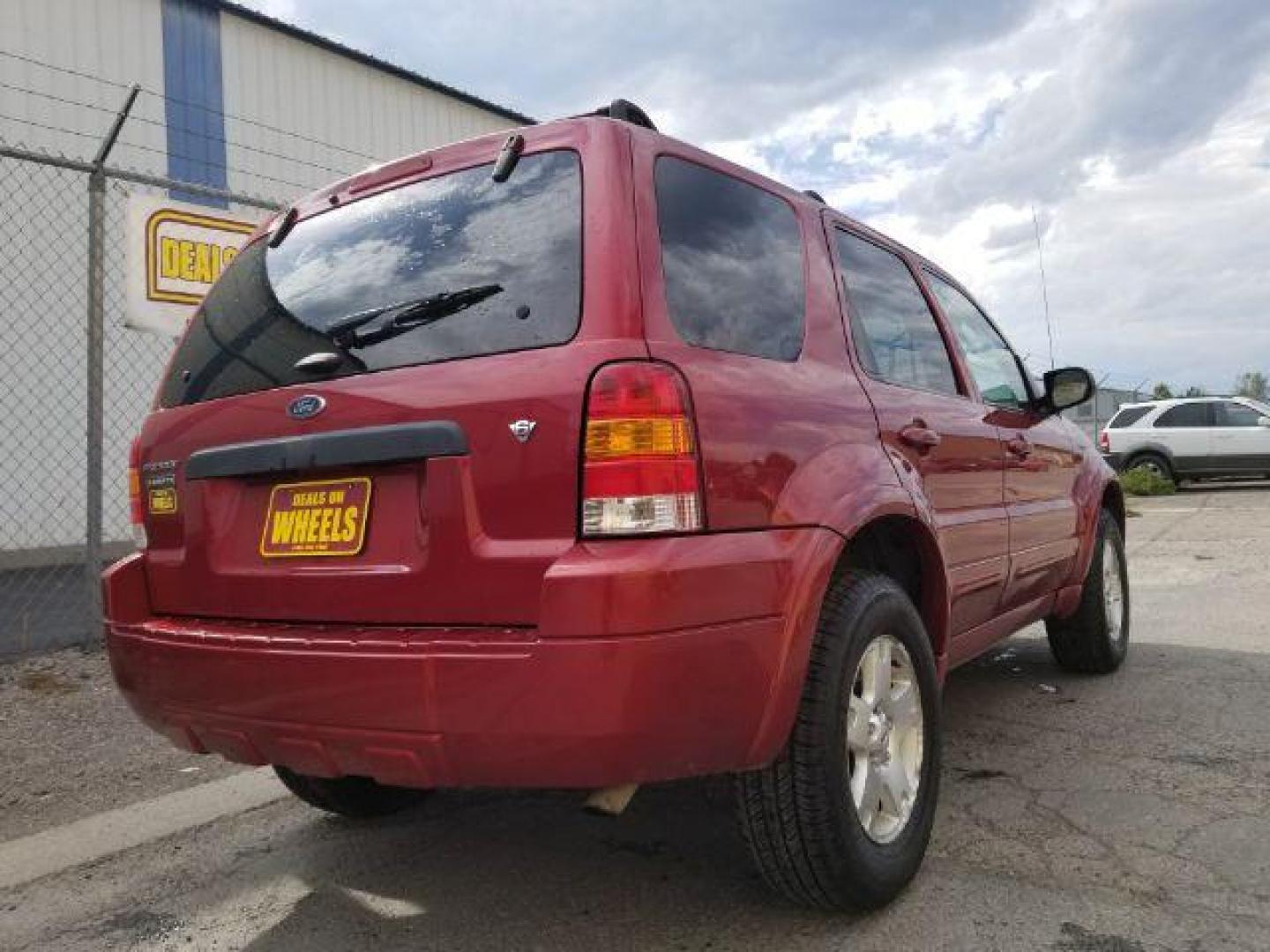 2007 Red Fire Metallic Ford Escape Limited 4WD (1FMYU94127K) with an 3.0L V6 DOHC 24V engine, 4-Speed Automatic transmission, located at 4801 10th Ave S,, Great Falls, MT, 59405, (406) 564-1505, 0.000000, 0.000000 - Photo#4