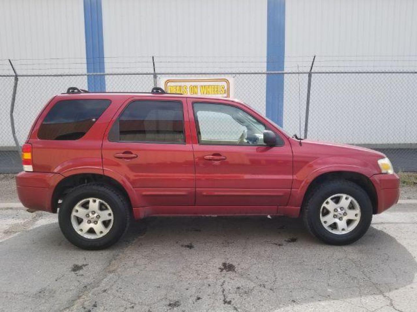 2007 Red Fire Metallic Ford Escape Limited 4WD (1FMYU94127K) with an 3.0L V6 DOHC 24V engine, 4-Speed Automatic transmission, located at 4801 10th Ave S,, Great Falls, MT, 59405, (406) 564-1505, 0.000000, 0.000000 - Photo#5