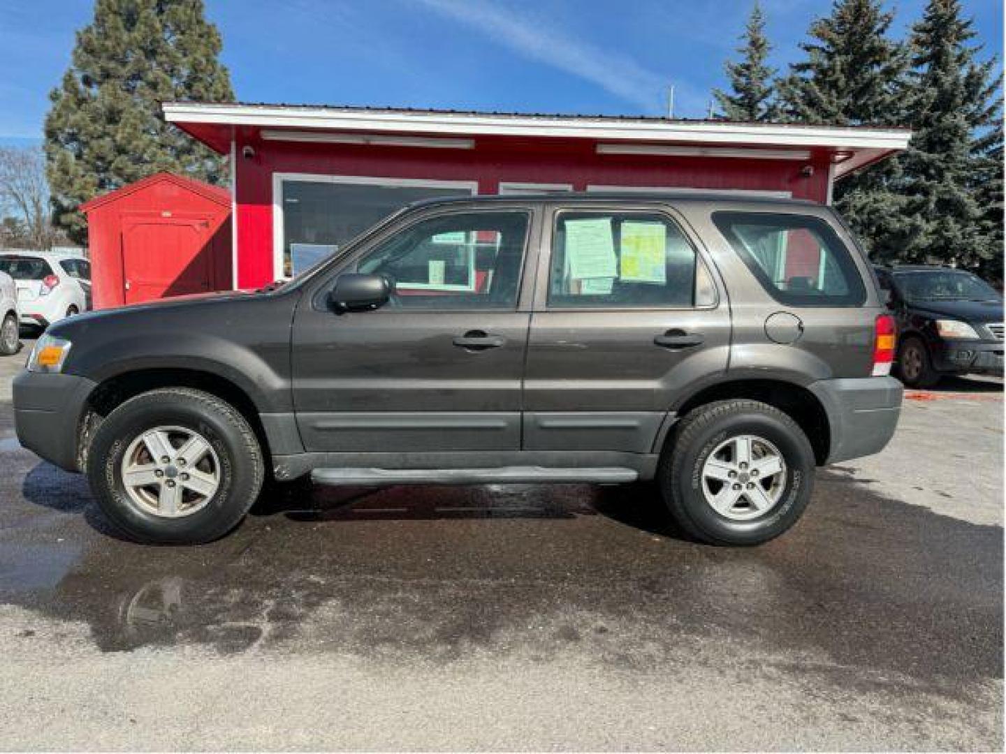 2007 Tungsten Grey Metallic Ford Escape XLS 4WD (1FMCU92Z87K) with an 2.3L L4 DOHC 16V engine, 4-Speed Automatic transmission, located at 601 E. Idaho St., Kalispell, MT, 59901, 0.000000, 0.000000 - Photo#1