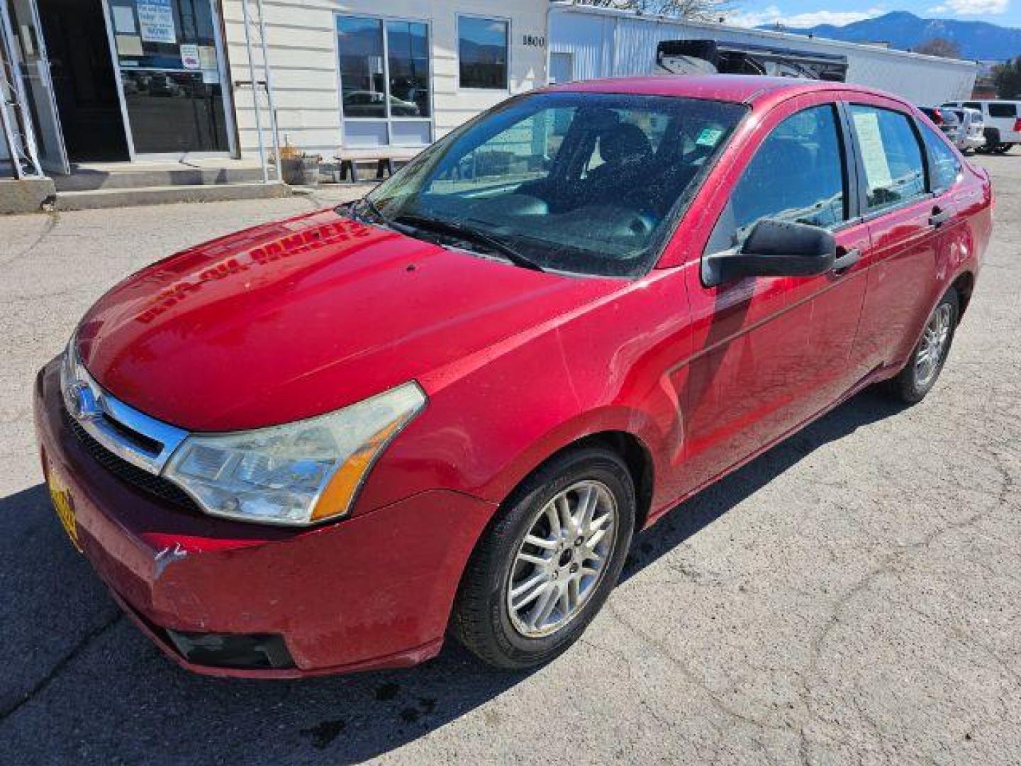 2009 Sangria Red Metallic /Medium Stone Cloth I Ford Focus SE Sedan (1FAHP35N59W) with an 2.0L L4 DOHC 16V engine, 4-Speed Automatic transmission, located at 1800 West Broadway, Missoula, 59808, (406) 543-1986, 46.881348, -114.023628 - Photo#0