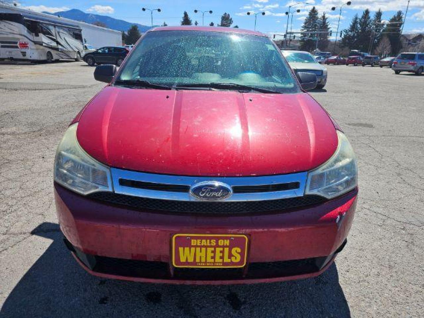 2009 Sangria Red Metallic /Medium Stone Cloth I Ford Focus SE Sedan (1FAHP35N59W) with an 2.0L L4 DOHC 16V engine, 4-Speed Automatic transmission, located at 1800 West Broadway, Missoula, 59808, (406) 543-1986, 46.881348, -114.023628 - Photo#1