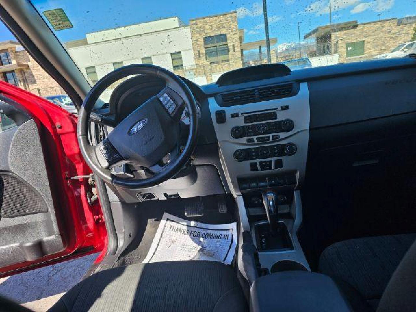 2009 Sangria Red Metallic /Medium Stone Cloth I Ford Focus SE Sedan (1FAHP35N59W) with an 2.0L L4 DOHC 16V engine, 4-Speed Automatic transmission, located at 1800 West Broadway, Missoula, 59808, (406) 543-1986, 46.881348, -114.023628 - Photo#6