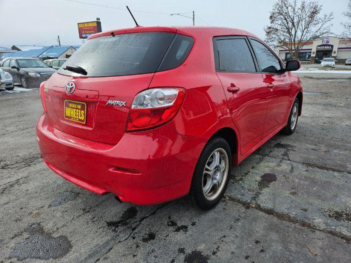 2009 Radiant Red Toyota Matrix Base 5-Speed MT (2T1KU40E09C) with an 1.8L L4 DOHC 16V engine, 5-Speed Manual transmission, located at 601 E. Idaho St., Kalispell, MT, 59901, 0.000000, 0.000000 - Photo#4