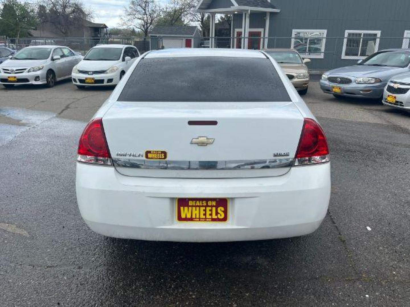 2011 Summit White Chevrolet Impala LS (2G1WF5EK9B1) with an 3.5L V6 OHV 16V FFV engine, 4-Speed Automatic transmission, located at 1821 N Montana Ave., Helena, MT, 59601, 0.000000, 0.000000 - Photo#4