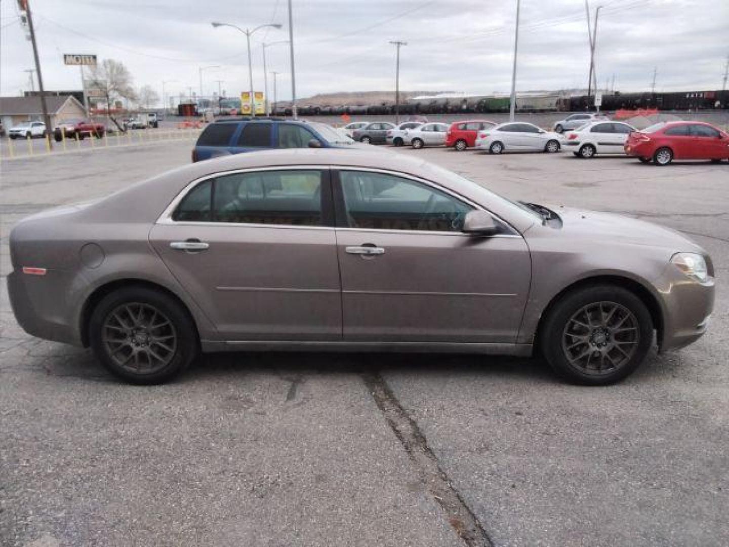 2012 Mocha Steel Metallic Chevrolet Malibu 2LT (1G1ZD5E05CF) with an 2.4L L4 DOHC 16V engine, 6-Speed Automatic transmission, located at 4047 Montana Ave., Billings, MT, 59101, 45.770847, -108.529800 - Photo#3