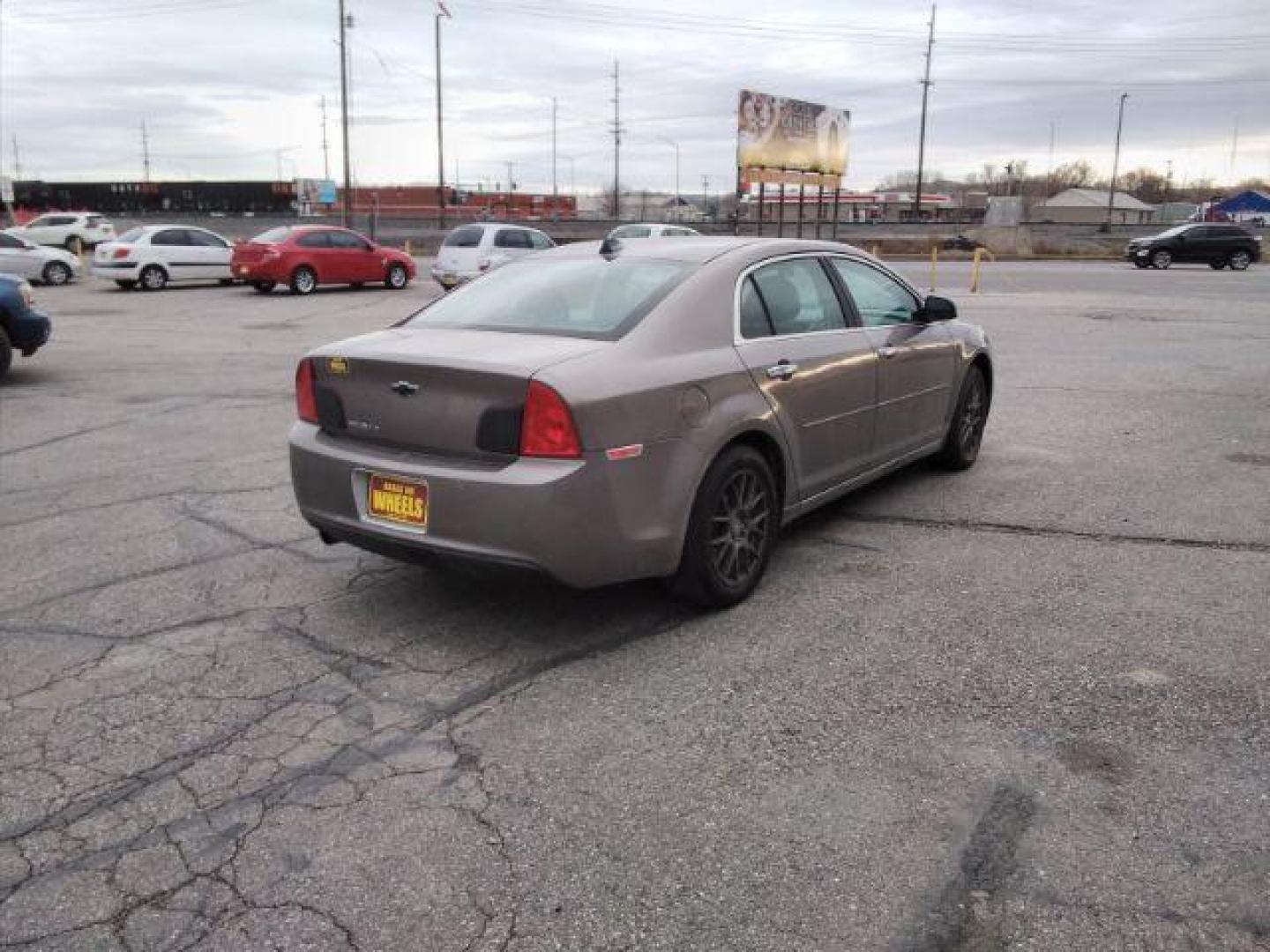 2012 Mocha Steel Metallic Chevrolet Malibu 2LT (1G1ZD5E05CF) with an 2.4L L4 DOHC 16V engine, 6-Speed Automatic transmission, located at 4047 Montana Ave., Billings, MT, 59101, 45.770847, -108.529800 - Photo#4