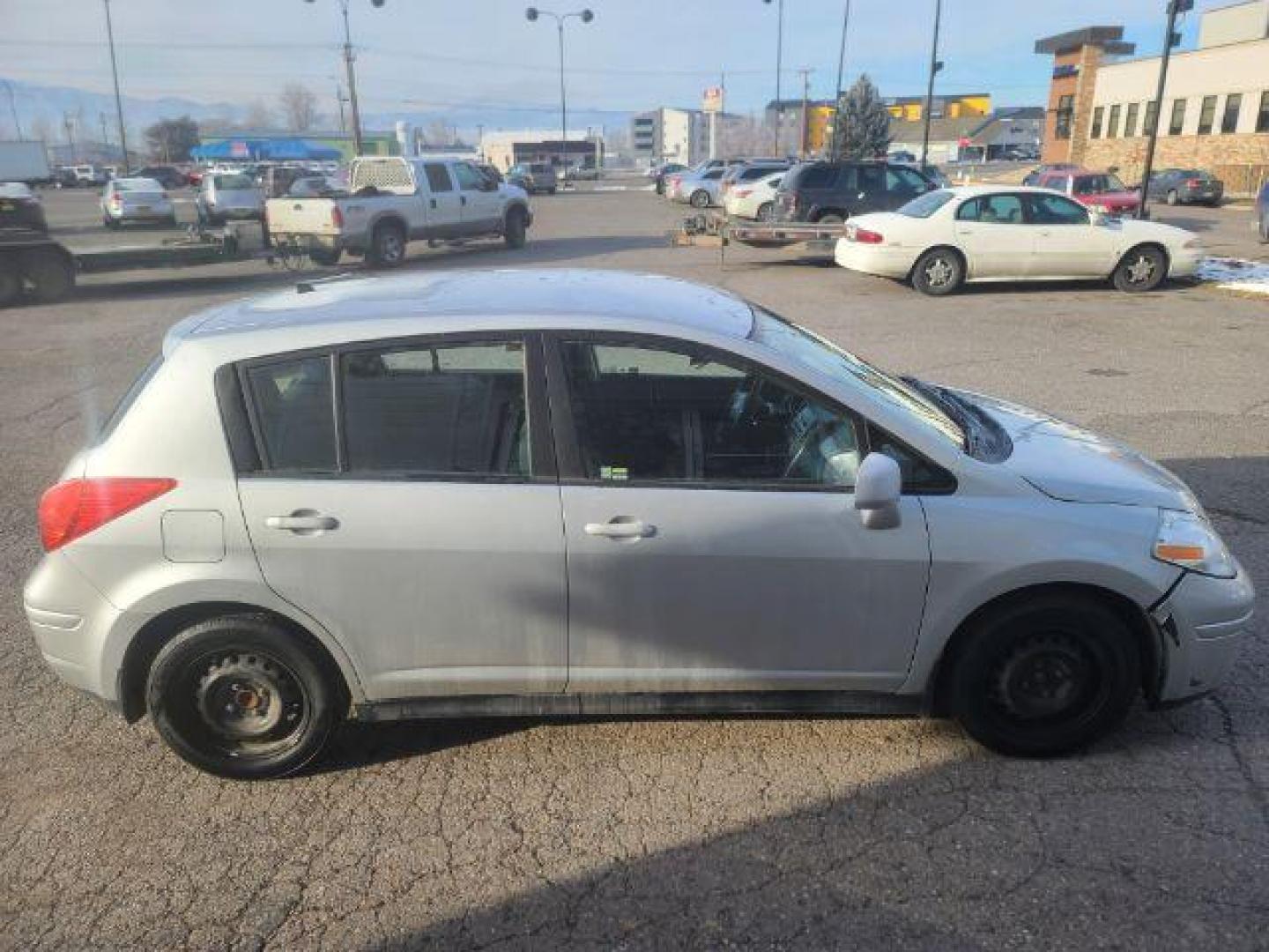 2012 Nissan Versa 1.8 SL Hatchback (3N1BC1CP8CL) with an 1.8L L4 DOHC 16V engine, Continuously Variable Transmission transmission, located at 1800 West Broadway, Missoula, 59808, (406) 543-1986, 46.881348, -114.023628 - Photo#2