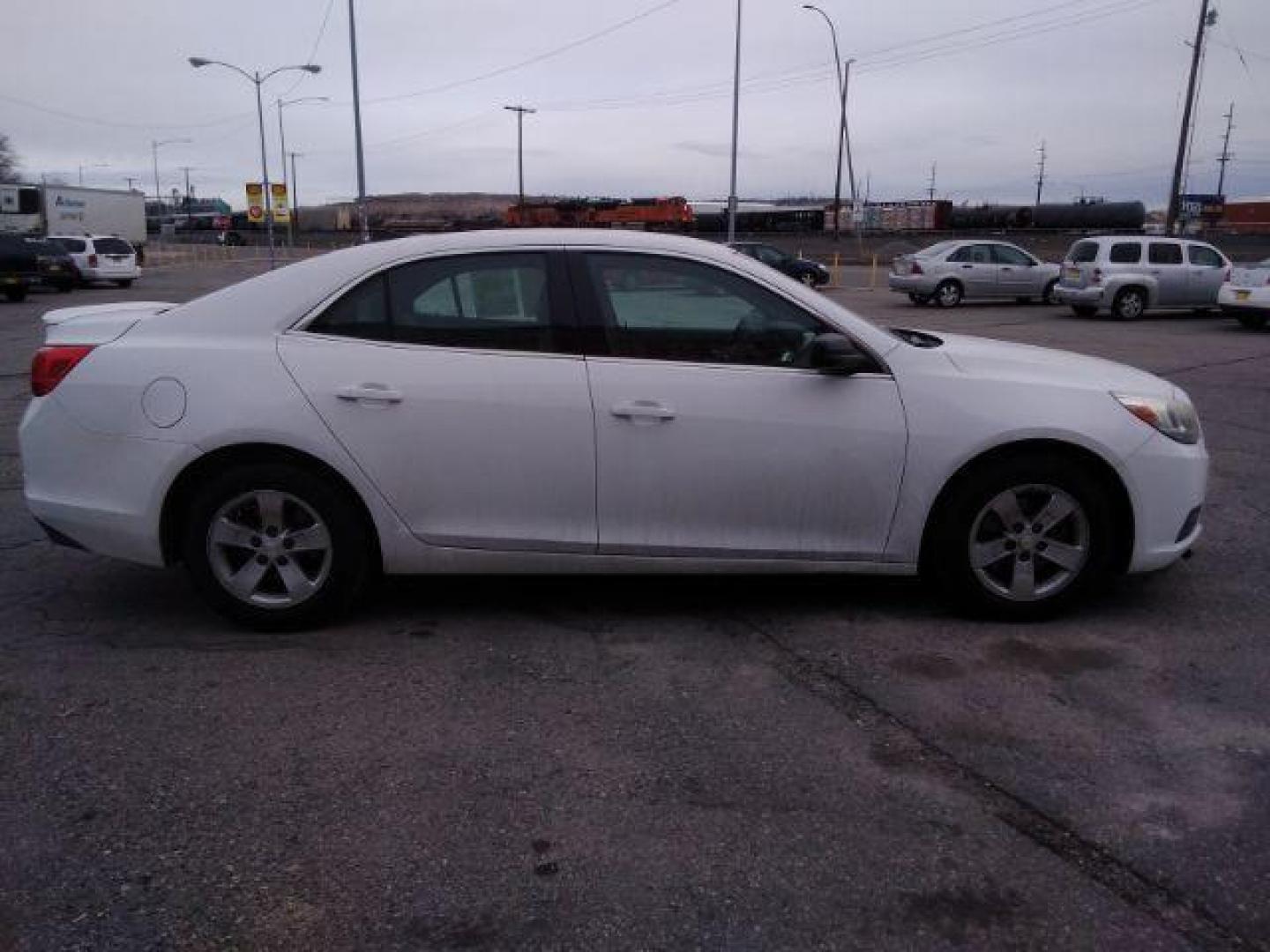 2013 Summit White Chevrolet Malibu LS (1G11B5SAXDF) with an 2.5L L4 DOHC 16V engine, 6-Speed Automatic transmission, located at 4047 Montana Ave., Billings, MT, 59101, 45.770847, -108.529800 - Photo#4