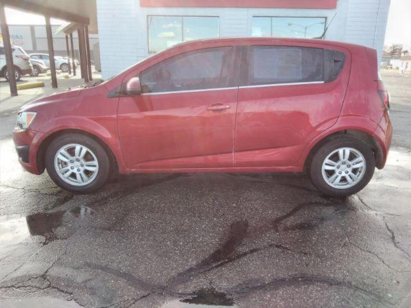 2013 Chevrolet Sonic LT Auto 5-Door (1G1JC6SB3D4) with an 1.4L L4 DOHC 24V TURBO engine, 6-Speed Automatic transmission, located at 4047 Montana Ave., Billings, MT, 59101, 45.770847, -108.529800 - Photo#7