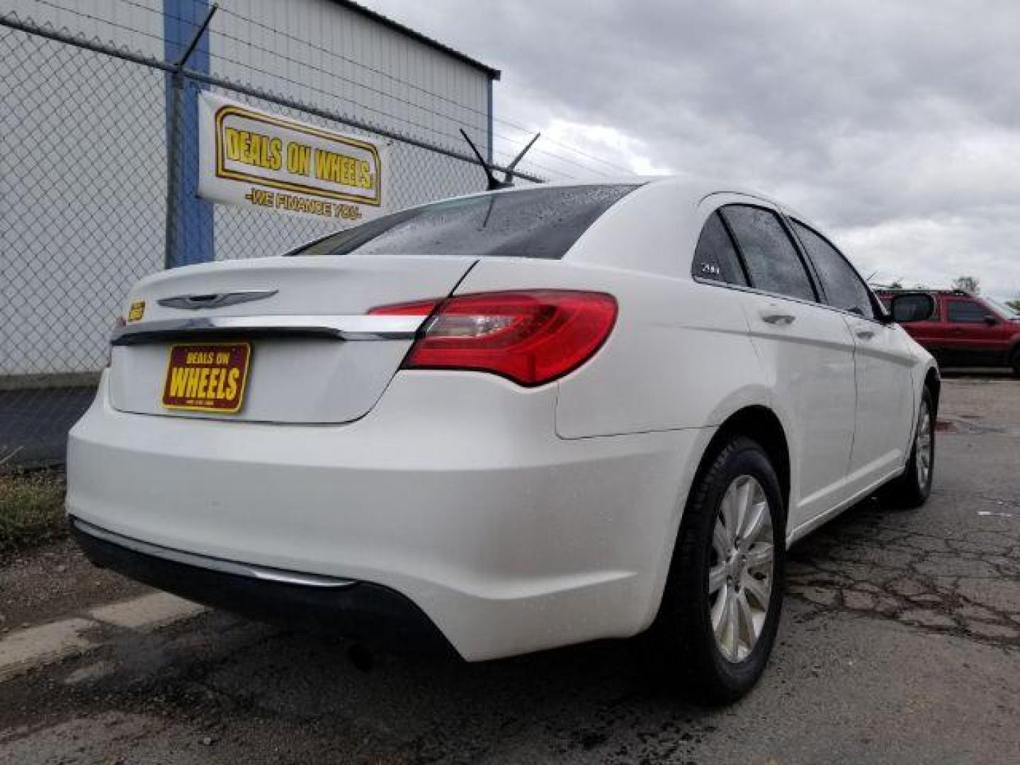 2013 Bright White Chrysler 200 Touring (1C3CCBBB4DN) with an 2.4L L4 DOHC 16V engine, 6-Speed Automatic transmission, located at 4801 10th Ave S,, Great Falls, MT, 59405, (406) 564-1505, 0.000000, 0.000000 - Photo#4