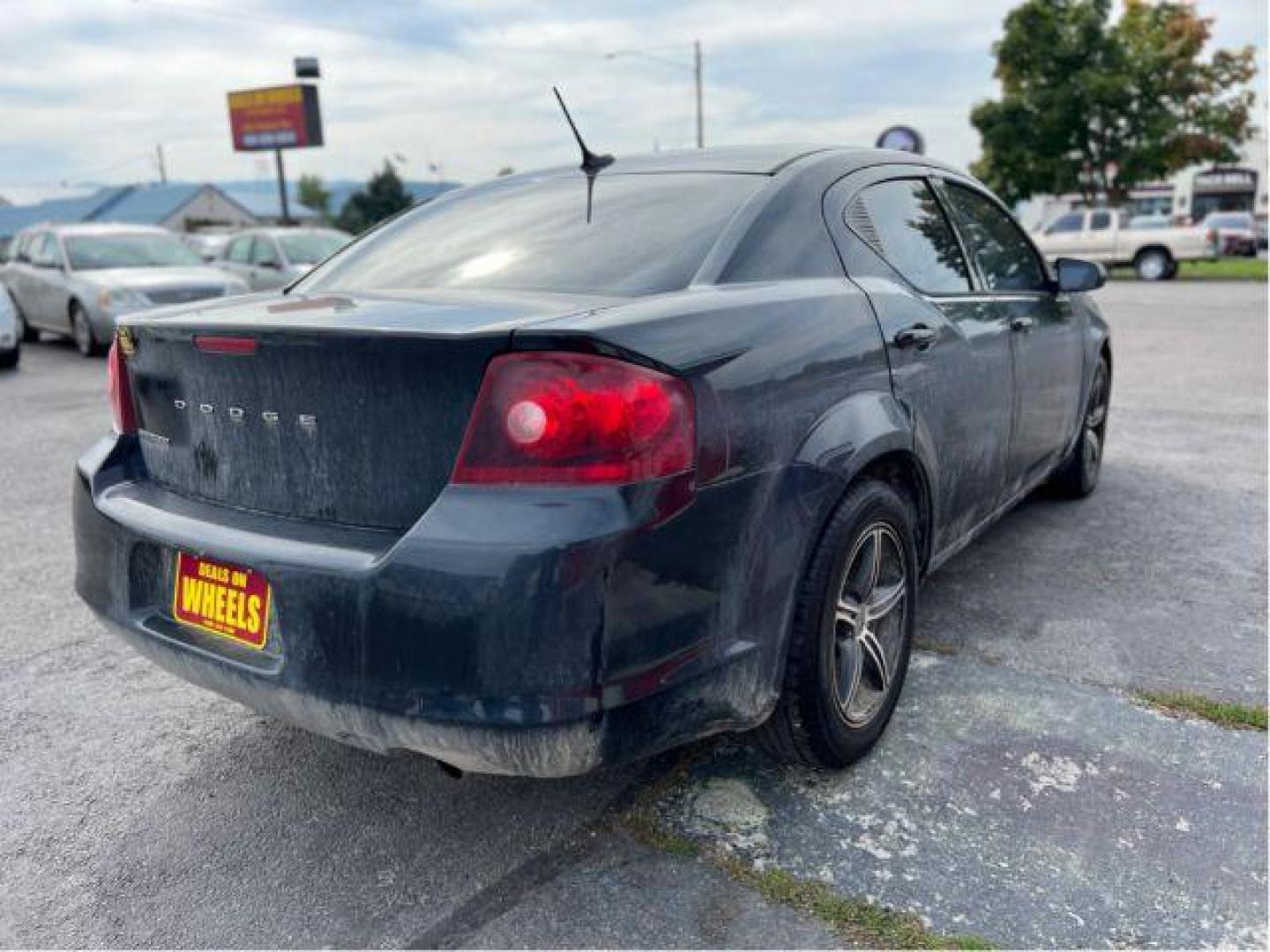 2013 Dodge Avenger Base (1C3CDZAB3DN) with an 2.4L L4 DOHC 16V engine, 4-Speed Automatic transmission, located at 4047 Montana Ave., Billings, MT, 59101, 45.770847, -108.529800 - Photo#4