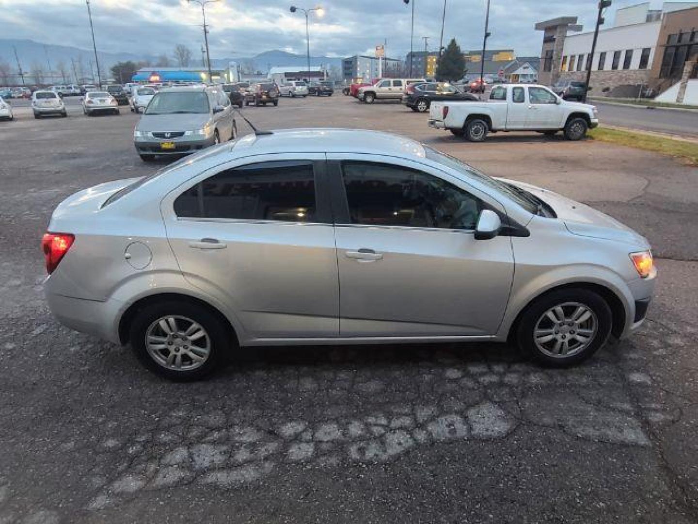 2014 Chevrolet Sonic LT Auto Sedan (1G1JC5SG7E4) with an 1.8L L4 DOHC 24V engine, 6-Speed Automatic transmission, located at 1800 West Broadway, Missoula, 59808, (406) 543-1986, 46.881348, -114.023628 - Photo#2