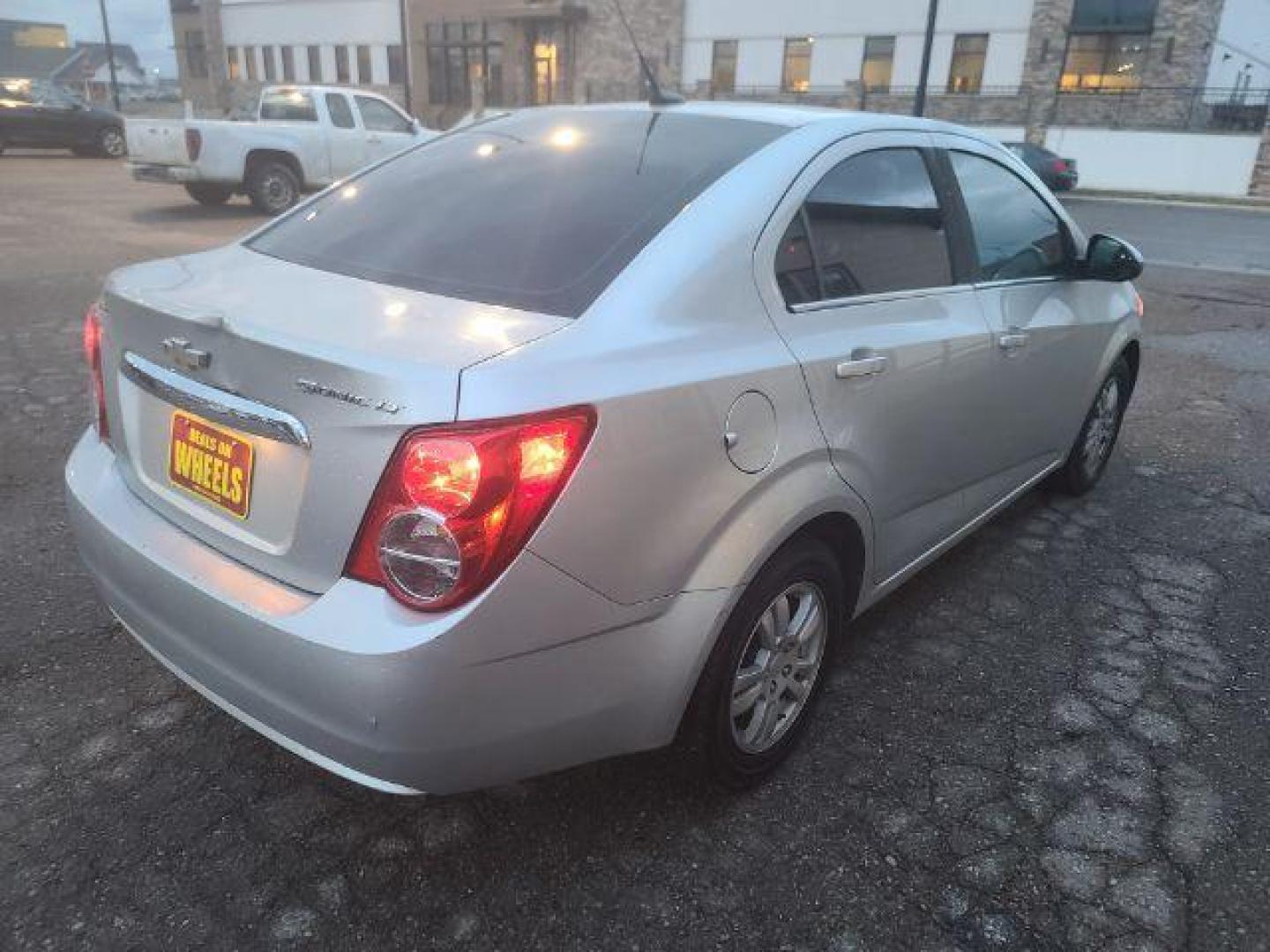 2014 Chevrolet Sonic LT Auto Sedan (1G1JC5SG7E4) with an 1.8L L4 DOHC 24V engine, 6-Speed Automatic transmission, located at 1800 West Broadway, Missoula, 59808, (406) 543-1986, 46.881348, -114.023628 - Photo#3