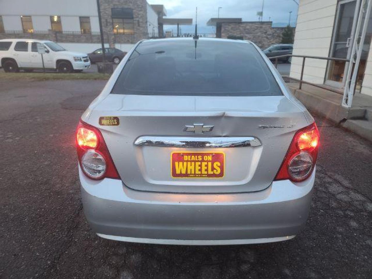 2014 Chevrolet Sonic LT Auto Sedan (1G1JC5SG7E4) with an 1.8L L4 DOHC 24V engine, 6-Speed Automatic transmission, located at 1800 West Broadway, Missoula, 59808, (406) 543-1986, 46.881348, -114.023628 - Photo#4