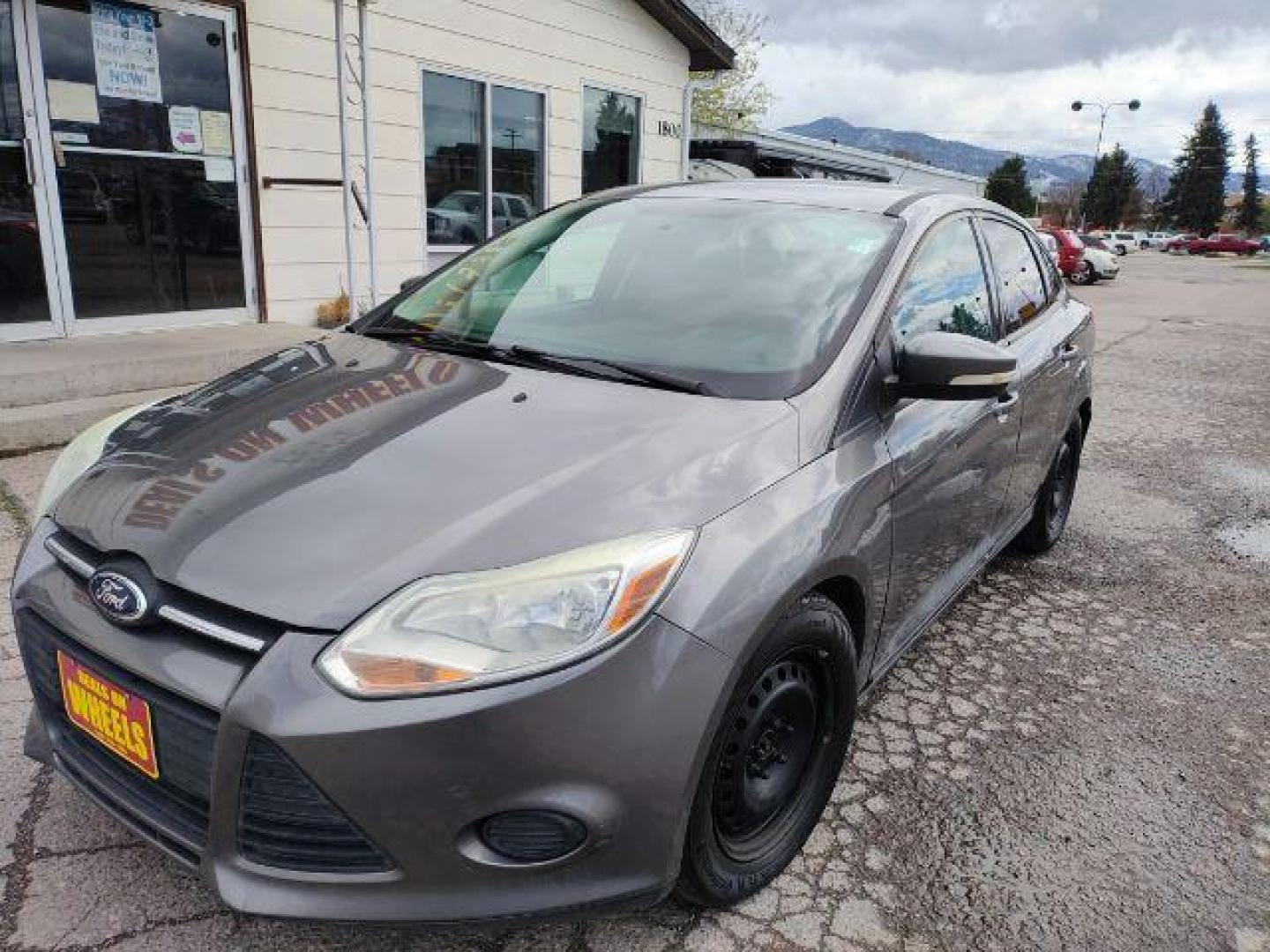 2014 Sterling Gray Metall /Charcoal Black Ford Focus SE Sedan (1FADP3F2XEL) with an 2.0L L4 DOHC 16V engine, located at 1800 West Broadway, Missoula, 59808, (406) 543-1986, 46.881348, -114.023628 - Photo#1