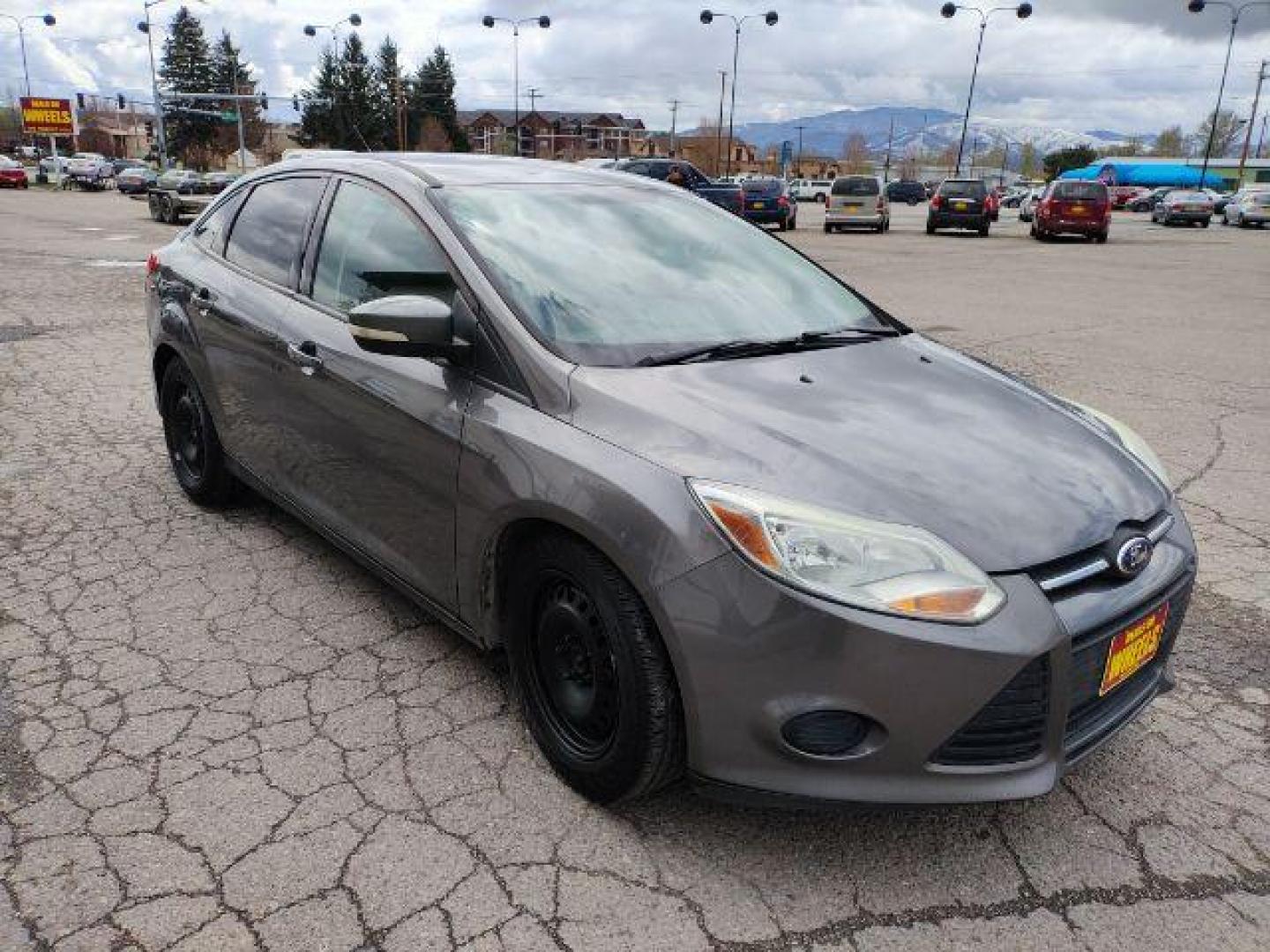 2014 Sterling Gray Metall /Charcoal Black Ford Focus SE Sedan (1FADP3F2XEL) with an 2.0L L4 DOHC 16V engine, located at 1800 West Broadway, Missoula, 59808, (406) 543-1986, 46.881348, -114.023628 - Photo#2