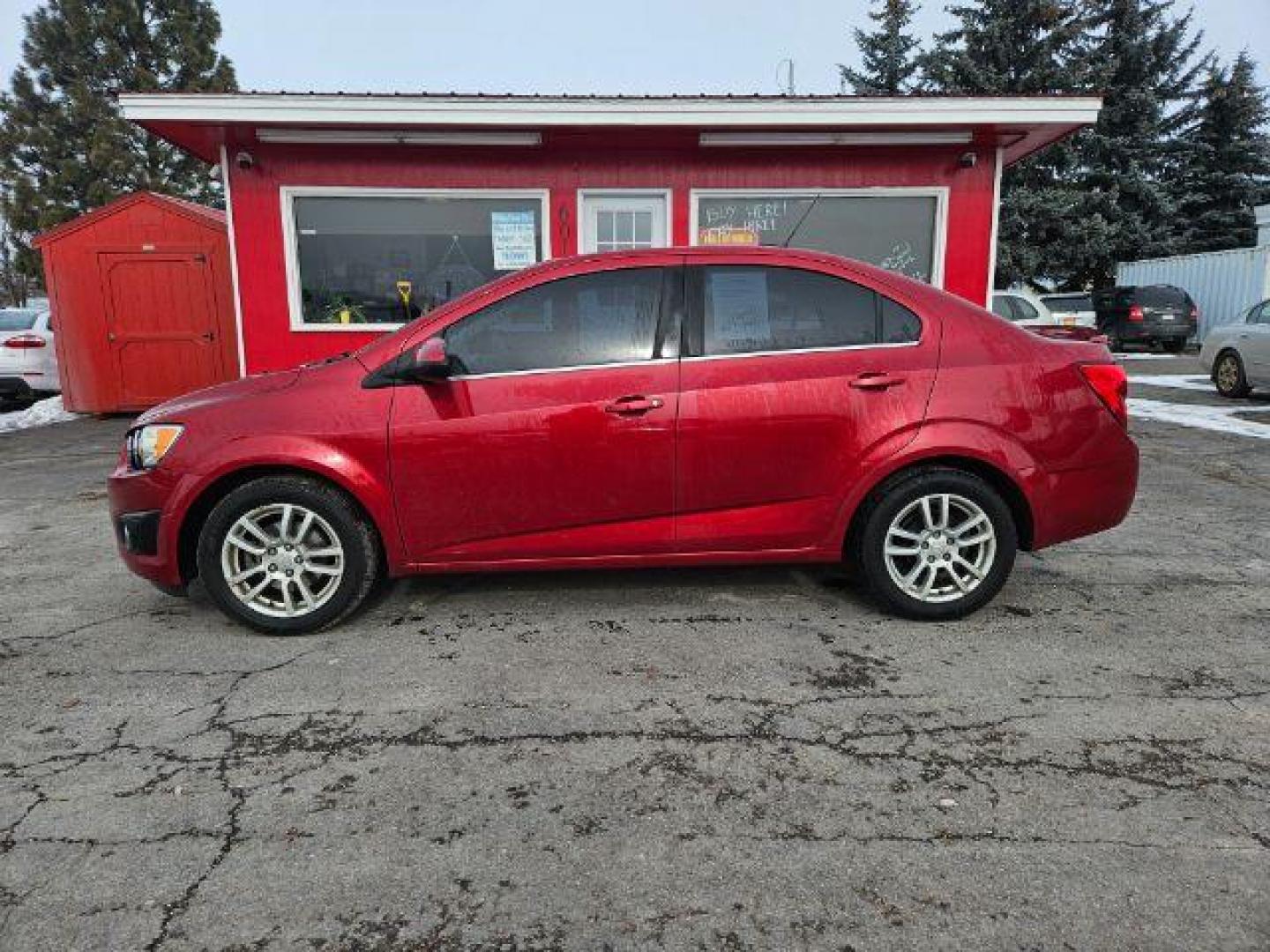 2015 Chevrolet Sonic LT Auto Sedan (1G1JC5SH4F4) with an 1.8L L4 DOHC 24V engine, 6-Speed Automatic transmission, located at 601 E. Idaho St., Kalispell, MT, 59901, 0.000000, 0.000000 - Photo#1